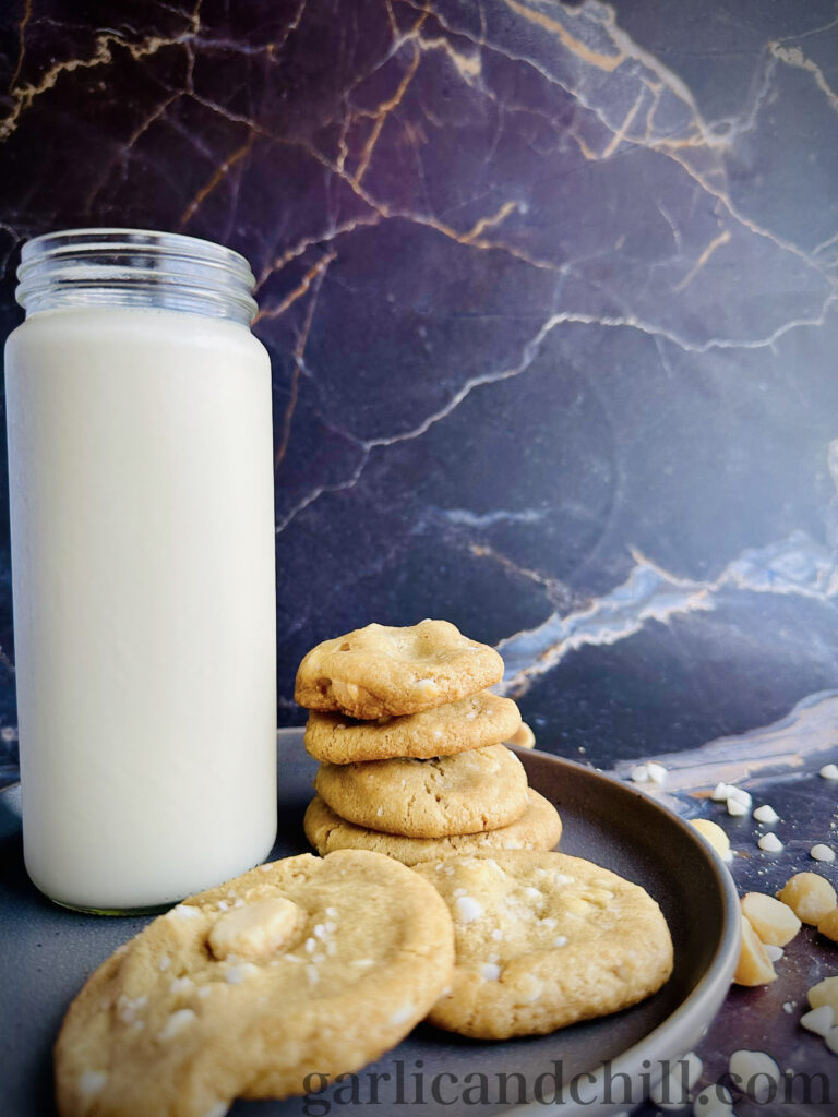 Vegan White Chocolate Macadamia Cookies with glass of oat milk