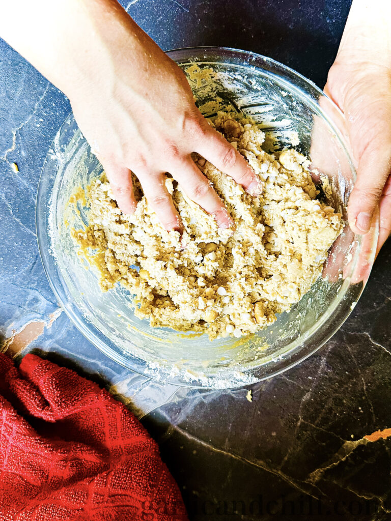 Mixing the Salted White Chocolate Macadamia Cookie by hand