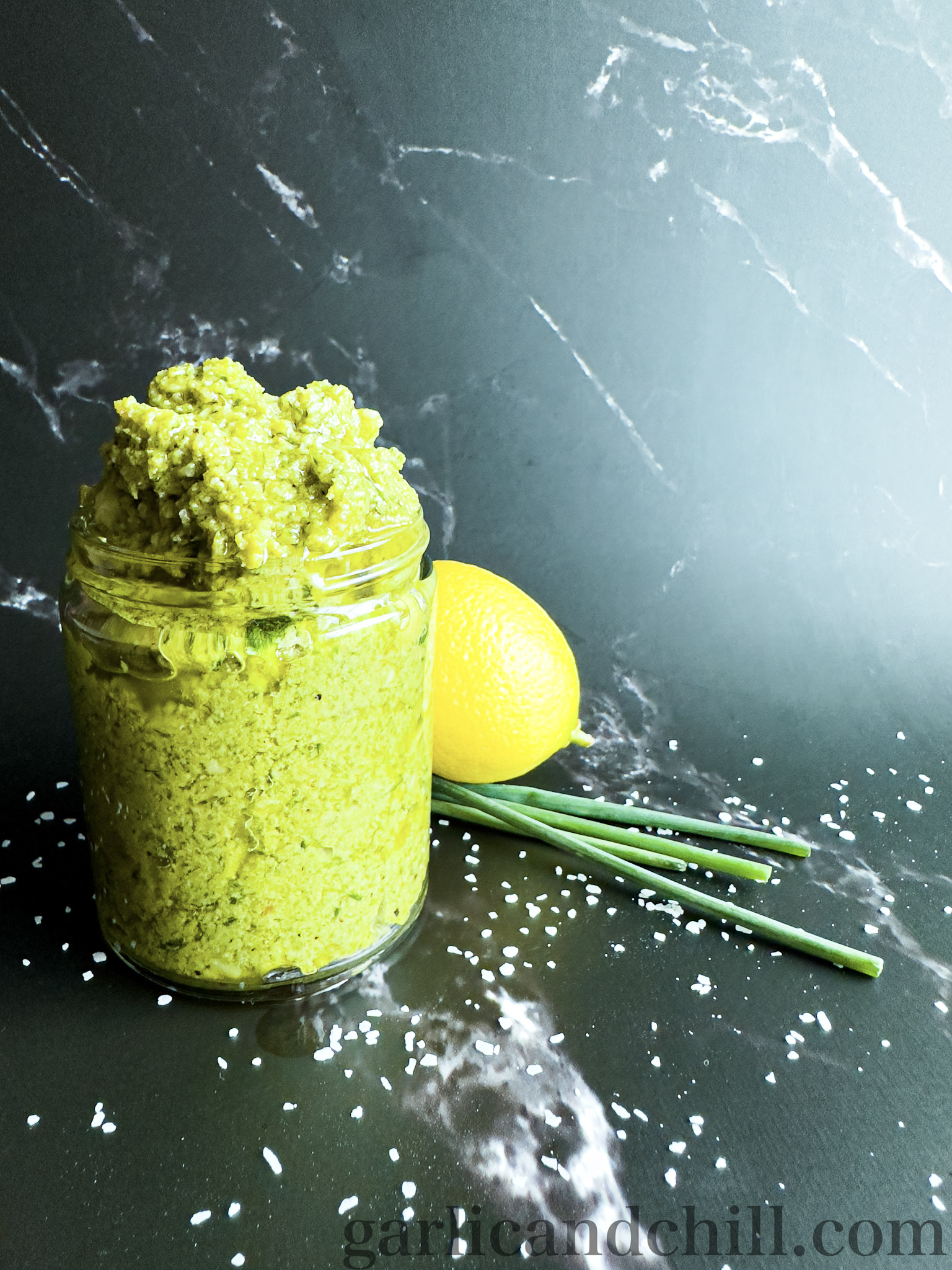 Vegan Preserved Lemon Pesto in Jar with Lemon and Chives