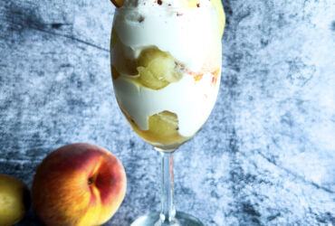 Creamy 'n' Tangy Kiwi-Peach Summer Parfait in glass (front)